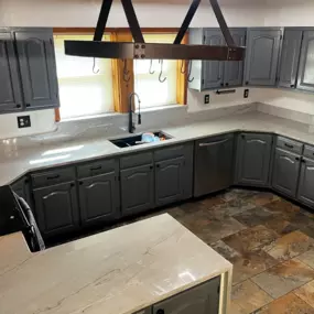 We were able to give this kitchen in Goshen a nice makeover. We installed Azzurra Bay Quartzite with a waterfall edge for the countertop. We also did the backsplash, and used an additional piece of the quartz for the window sill. The homeowner chose a black double bowl workstation sink with a matte black faucet and we installed both. Are you looking for ideas for your kitchen? Visit our Facebook page for ideas, or call us for help.