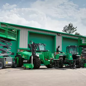 Sunbelt Rentals branded plant and powered access equipment outside a depot.