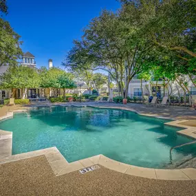 Outdoor pool with large trees
