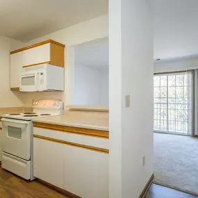 A kitchen with white appliances