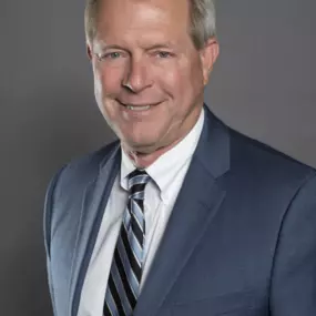 Scott W. Mach was born in Manhattan, Kansas and graduated with a degree in journalism from Kansas State University. He was a four-year varsity letterman on the Kansas State Baseball Team where he still ranks in the top five in career wins as a pitcher. He graduated from the University of Kansas Law School in 1981 and went directly to work at Popham Injury Law, where he became a partner in 1987.