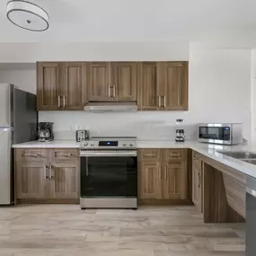 A full kitchen with refrigerator, stove, microwave and dishwasher in a room at Parkway International Resort