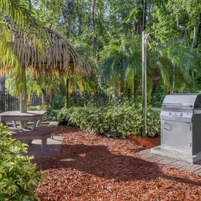 The BBQ area with picnic table at Parkway International Resort