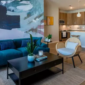 Modern apartment living room and kitchen with open layout at Alton Mill District in Charlotte, NC