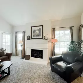 Living room with couch and table, ceiling fan and light