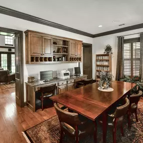 Dining room table with chairs and a carpet