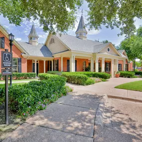 Exterior view of leasing office with green lawn