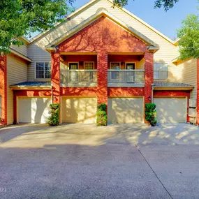 Exterior of apartment with parking garage