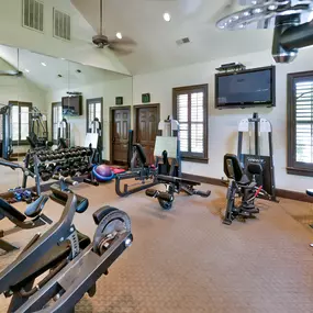 Modern fitness center with brown floor