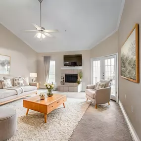 A living room with couches and chairs and a fireplace