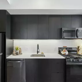 Modern kitchen with black refrigerator