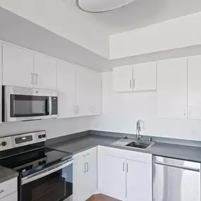 Kitchen with sink and white cabinets
