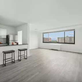 A Spacious Kitchen With Bar Stools