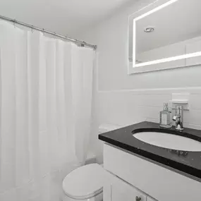 A Bathroom With a White Sink