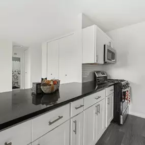 A Kitchen With a Black Countertop