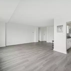 A Spacious Room With Wooden Flooring