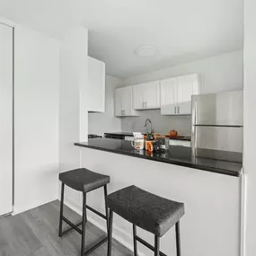 A Kitchen With White Cabinets