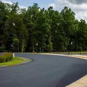 Sealcoating a road for Loudoun Country Public Schools