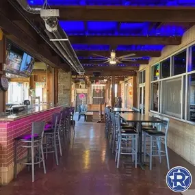 Our full-service covered patio bar is the perfect place to relax, with TVs, a jukebox, and a variety of games like darts and a tabletop ring hook game. We'll keep you comfortable in any weather with heaters for chilly nights and fans with misters for hot days. Plus, your furry friends are welcome—we're dog-friendly! We've also added more seating for you and your friends to enjoy.