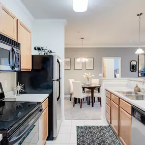 Kitchen with black appliances and wooden cabinets