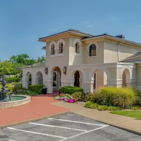 Building with a fountain in front of it