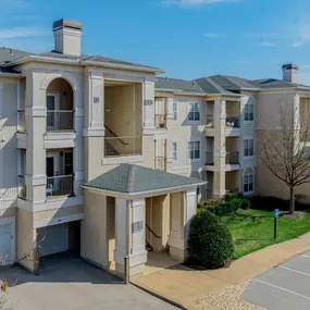 Exterior of apartment with view of resident parking