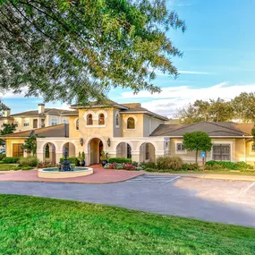 Exterior of apartment with green lawn
