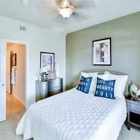 Spacious bedroom with ceiling fan