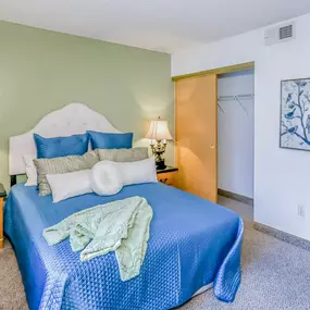Spacious bedroom with ample storage space in closet