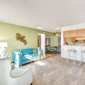 Spacious living room with barstool seating in the kitchen