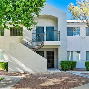 Exterior of apartment with stairs and trees