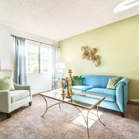 Living room with natural light and seating