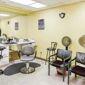 On-site hair salon with yellow walls