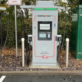 InstaVolt ultra-rapid EV charging station uncovered and ready for use, featuring a user-friendly interface and tap-and-go payment options