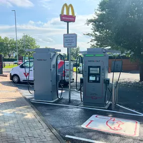 InstaVolt EV charging units installed next to a McDonald’s, offering convenient ultra-rapid charging with easy access and visible signage in a retail park setting.