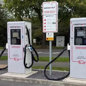 Well-marked InstaVolt ultra-rapid charging location on Stallings Lane with easy roadside access and tree-lined surroundings in Kingswinford.
