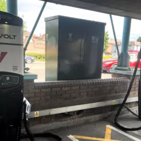 InstaVolt charging units located in a sheltered parking bay, providing convenient ultra rapid charging for electric vehicles.