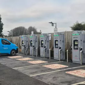 InstaVolt ultra rapid chargers in use at The Gissons Hotel, Kennford, with a British Gas electric van parked at one of the bays. Clear signage and marked spaces support easy EV charging near the A38.