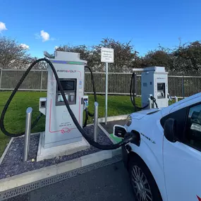 Electric vehicle charging at InstaVolt ultra-rapid charger near McDonald’s Colsterworth, Grantham.