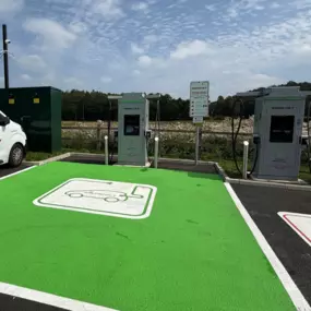 InstaVolt chargers at a clean, modern site with dedicated EV bays and an InstaVolt van in view, located next to a Starbucks off the A64 near York.