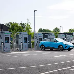 A row of InstaVolt ultra-rapid chargers in use outside McDonald’s in Crawley, offering convenient EV charging for customers.