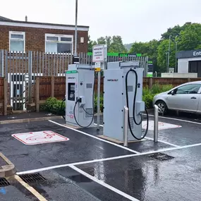 Two InstaVolt chargers in a dedicated EV bays at McDonald's, ideal for quick top-ups while shopping or commuting.