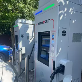 Detailed view of the InstaVolt charger interface at McDonald’s Bullsmoor Lane, highlighting user-friendly payment options and connector types.