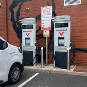 Ultra-rapid InstaVolt chargers located at KFC Old Hill, easily accessible next to a parking bay and power supply unit.