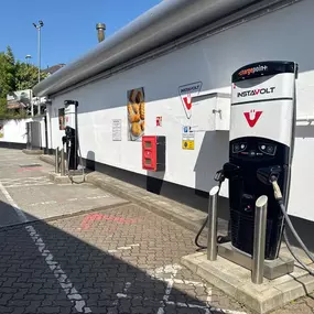 EV chargers at Taw Garage Esso in Barnstaple, offering InstaVolt’s rapid charging with clear access and marked bays.