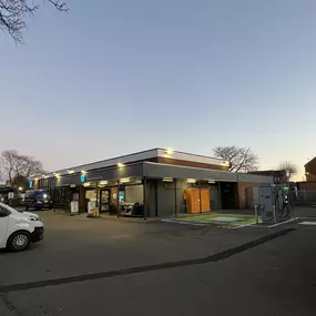 Co-op Wilford with InstaVolt ultra rapid chargers in Wilford Green, surrounded by amenities such as Lidl and Starbucks, offering easy access for EV drivers.
