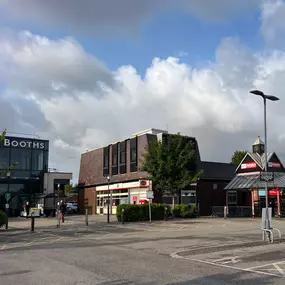 Main retail area at Teanlowe Shopping Centre in Poulton-le-Fylde, featuring Booths supermarket, Home Bargains, and other local amenities near InstaVolt EV charging.