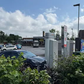 InstaVolt rapid chargers positioned at a McDonald’s drive-thru, offering convenient charging while grabbing a meal.