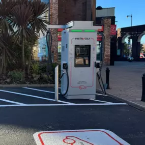 An InstaVolt ultra-rapid charger installed at Marshall’s Yard in Gainsborough, located next to Phone Outlet and surrounded by shops and landscaping, offering easy and convenient access for EV drivers.