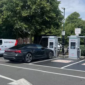 EV drivers charging at InstaVolt ultra-rapid chargers near McDonald’s on Penn Road, Wolverhampton. The site offers dedicated EV bays and convenient access for all vehicle types.